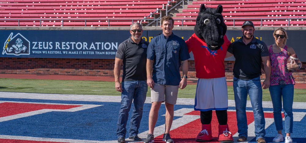 Zeus Restoration Team with SMU Mustang Mascot